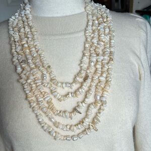 Handcrafted strands of shell chips and fresh water pearls,  gold chain necklace